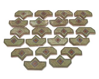 1228
1926-1931
A collection of Malibu Potteries tiles
Six incised to underside: DN4
The group of matching polychrome glazed ceramic tiles, each depicting a diamond motif in blue, rust red, and brown on a light green ground, 21 pieces
Each: 5.75" 10" W x 1" D
Estimate: $700 - $900