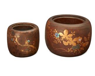 1105
Late Meiji Era 1868-1912
Two Japanese hibachis
Each stamped with faint characters to underside
The carved wood hibachis with copper lining, each adorned with inlaid mother of pearl and gilt-painted decorations, comprising one larger with floral motifs and one smaller with floral and avian motifs, 2 pieces
Larger: 7.75" H x 11" Dia.; Smaller: 6.375" H x 7.5" Dia.
Estimate: $300 - $500