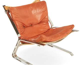 1259
Elsa & Nordahl Solheim (1922-2012 and 1919-2014)
A "Pirate" lounge chair for Rybo Rykken & Co., mid-20th century; Norway
Unmarked
The chair with chromed metal cantilevered frame, canvas sling, and orange leather upholstered seat and seatback cushions
27.25" H x 24.75" W x 30" D
Estimate: $300 - $500