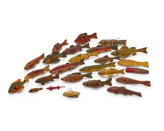 1098
Early 20th century
A group of polychrome wood fishing lures
The painted carved wood fish-figure lures depicting various species, each mounted with metal fins, 25 pieces
Longest: 8.375" L; Shortest: 3" L
Estimate: $300 - $500