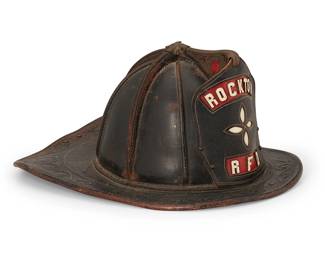1135
Circa 1930
A Cairns & Brothers fireman helmet
Badge reads; Rockton / RFD; interior with metal tag: Cairns & Brother / New York / Mfrs of Firemens Equipment & Supplies
The metal and black leather helmet with front and rear visors, featuring a leather badge, the interior with cotton canvas and felt liner and neck guard
6.625" H x 11" W x 14.5" D
Estimate: $400 - $600