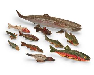 1099
Early 20th century
A group of polychrome wood fish lures
The painted carved wood fish-figure lures depicting various species, each mounted with metal fins, one with articulated body, 11 pieces
Longest: 30.125" L; Shortest: 6.875" L
Estimate: $600 - $800