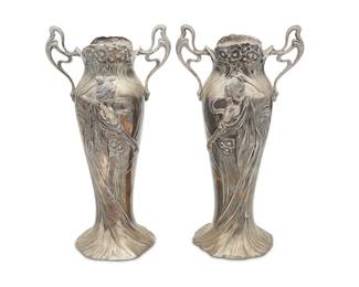 1166
Early 20th century
A pair of WMF Jugendstil pewter vases
Each marked for WMF
The vases with open bottoms and opposed handles, each featuring opposed maiden figures in high relief surrounded by flowers, 2 pieces
Each: 14.5" H x 7.75" W x 6.25" D
Estimate: $800 - $1,200