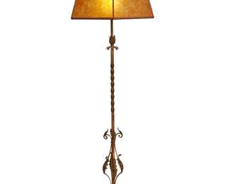 1094
20th century
A Spanish-style floor lamp and mica shade
Unmarked
The two-light lamp with polychrome and wrought-iron twisted standard mounted with foliate-form gilt-metal accents and set on a marble base, surmounted by a possibly later hexagonal mica shade, electrified
Overall: 66" H x 21.5" W x 19" D
Estimate: $300 - $500