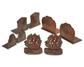 1092
Early 20th century
Four pairs of Arts & Crafts metal bookends
One pair marked with Roycroft orb; another pair marked: Old Mission / San Francisco / [centering mission building logo]; another pair marked: [arm & hammer logo] made by hand / 10; iron unmarked
Comprising a pair of Roycroft hammered copper bookends, two pairs of Mission Kopper Kraft hammered copper bookends, and a pair of polychrome cast iron bookends, 8 pieces
Largest: 5.5" H x 6" W x 4" D
Estimate: $300 - $500