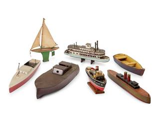 1101
Early 20th century
A group of polychrome wood and metal model ships
Sailboat marked: J. Chein & Co. / Made in U.S.A.; another marked: Peter
Comprising a painted metal sailboat with canvas sails, a riverboat, a rowboat, a speedboat, a steam boat, and two model vessels, 7 pieces
Largest: 5.5" H x 27.75" W x 7.75" D
Estimate: $500 - $700

