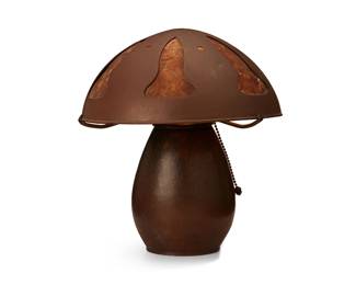 1090
Circa 1915-1977; San Francisco, CA
A Dirk van Erp hammered copper table lamp base
Base signed: Dirk van Erp / San Francisco [open-box mark]
The Arts & Crafts single-light lamp with a bulbous copper base issuing three arms surmounted by an associated copper and mica domed shade, electrified
Overall: 11" H x 9.75" Dia.
Estimate: $2,000 - $3,000