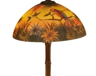 1172
The base early 20th century; Meriden, Connecticut
A Handel patinated metal bamboo lamp base with later shade
Base with cloth tag to underside: Handel Lamps; shade unmarked
Base designed 1921, the three-light patinated metal lamp with bamboo-form standard, with associated glass shade reverse-painted with parrots in a forest, with an associated composition parrot finial, electrified
Overall: 27" H x 17.75" Dia.; Shade height: 7.75" H
Estimate: $500 - $700