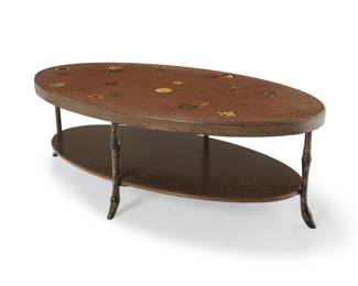1258
Late 20th/early 21st century
A Modern stone and metal coffee table
The oval stone top inlaid with Japanese style medallions, raised in a painted metal bamboo-form frame
Overall: 18.25" H x 54.5" W x 30.5" D
Estimate: $700 - $900