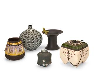 1070
Late 20th century
A group of Contemporary art pottery vessels
Two marked: B Saito / 84; one marked: Adams / 1986; another marked: SVD / 85; the last marked illegibly
Comprising two polychrome art ceramic vessels by Beverly Saito including a vase with paw track marks and mounted points and feathers, and a lidded footed trinket box with sgraffito details, the lid bound by string; a frog-form-mounted vase by Nancy Adams (b. 1970), a stylized lidded box, and a Southwest-style bud vase with geometric fine-line sgraffito motifs, 5 pieces
Largest: 6.625" H x 6.375" Dia.; Smallest: 3.625" H x 2.875" W x 2.875" D
Estimate: $400 - $600