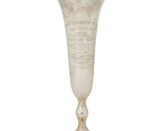 1022
1929
A Tournament of Roses sterling silver trophy
Marked to underside: Charles H Kelley / Jewelers Since 1896 / Sterling Loaded / 111; engraved: Pasadena Tournament of Roses / New Year's Day 1929 / Third Prize-Class F/ Business Firms and Manufacturers / Gift of Tournament of Roses Association / Awarded to / Los Angeles Steamship Company
The weighted hand-hammered sterling trophy vase, with shaped flared rim
12" H x 5.5" Dia.
Estimate: $800 - $1,200
