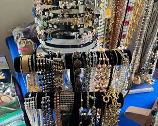 Necklaces, bracelets, sterling, clip earrings, rings, antique purses, small coin collection, Nikon cameras