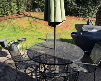 Presale item priced at 130. Iron outdoor table and 4 chairs. Table diameter is 48".