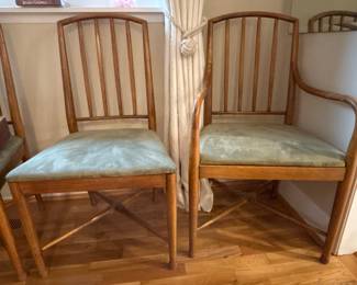 Captain's chair on right, side chair to dining table set. Covered in green microsuede years ago to protect from cat claws, but underneath is a lovely dressier light blue jacquard fabric. The choice is yours -- easily changeable with staple removal! There are 6 chairs, one has broken spot in the back section that could be repaired.