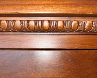 Detail on flame chest of drawers