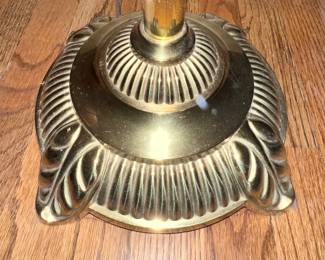 Detail view of brass floor lamp base