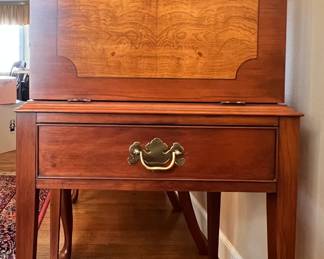 Drop front cherry inlaid burlwood silver chest