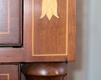 Detail view of inlaid chest of drawers