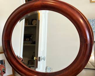 Oval mirror with simple wood frame
