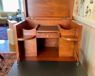 Drop front view of silver chest
