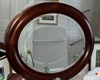 Oval mirror with simple wood frame