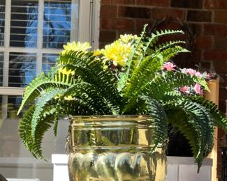 Brass planter with artificial plant