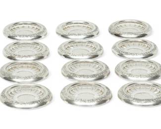 Lot 1072
International Sterling Silver And Glass Coasters (12)