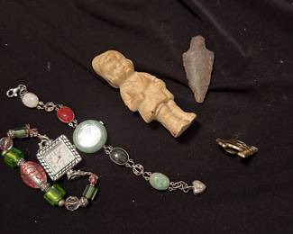 Watch, bracelet, figurine, arrowhead collectibles