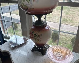 Vintage hand painted hurricane lamp has. been repaired but works great.