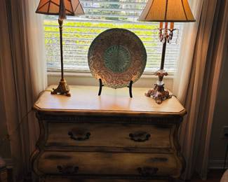 Nightstand capable of holding two lamps.  Now that's sturdy furniture.