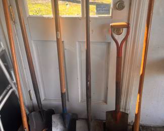 shovels and assorted garden tools