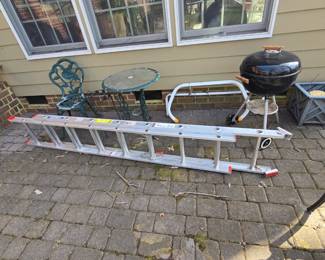 extention ladder and grill with patio furniture 