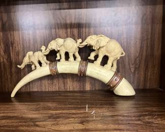 Resin Elephants on a Tusk Sculpture
