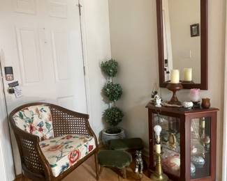 Vintage cane side barrel chair, topiary, 2 small green covered footstools, lamp, mirror, wood and glass display case...