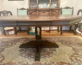 Vintage dining room table (has 2 leafs) with 6 green upholstered chairs, rug..,