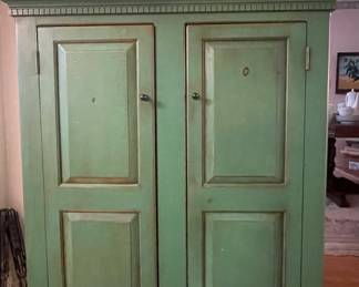  Green wood cabinet; two doors with shelves