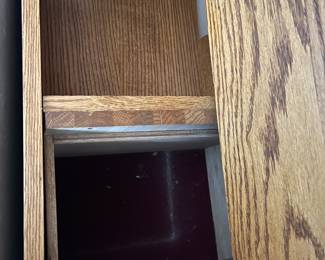 Hidden storage in oak bed frame