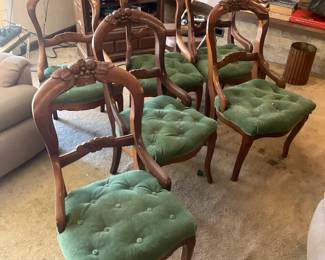 Set of six matching walnut dining chairs.