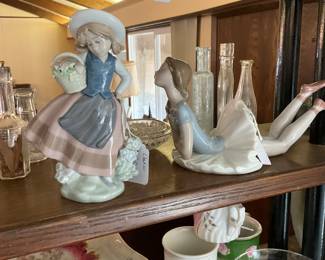 Several nice examples of lladro figurines.
