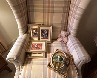 A lovely wingback chair for the bedroom in excellent condition with some great little artwork