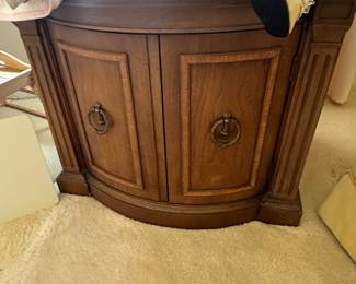 Here’s another great end table. It’s round with two doors.