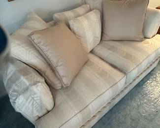 In the formal living room, there is beautiful furniture. This is the loveseat, comfy, and an excellent condition.!