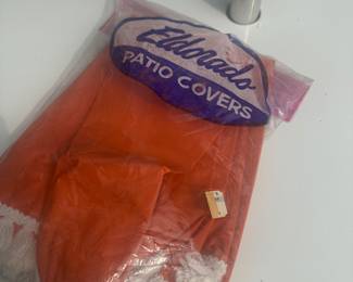 This is the tablecloth in its original package. It has a hole in the center for the umbrella post.