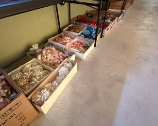 Under the table are literally hundreds of premade bows of every shape and size! Many of them are in the pastel color scheme