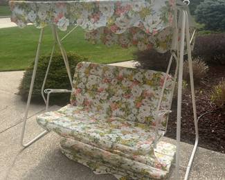 This is a fantastic mid-century modern two person swing! It is an excellent condition the cushion and the vinyl top are floral patterned! And you’ll notice under the seat is an extra cushion!