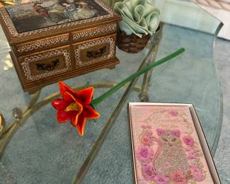 There’s a nice musical jewelry box a little journal downright and an excellent example of a Marano glass flower!