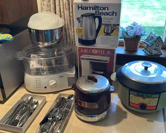 Another series of small kitchen appliances several of them have never been used, and I love the vintage crockpot down to the right avocado green!