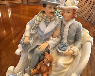 This is a lovely centerpiece of a Victorian couple on a sleigh ride!