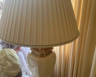 This is a lovely cream colored and brass accent lamp! All the lamps and furniture in this home are just pristine!