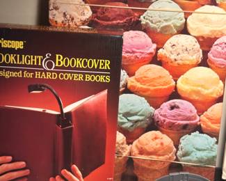 Left is a book light and book cover mint in the original box and directly behind. It is an ice cream cone puzzle.!